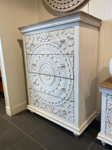 Casa whitewashed mango wood four-drawer chest in a bedroom setting