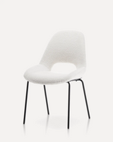 Modern velvet upholstered dining chair with an open-back design, tufted backrest, and black metal legs for hotels, Airbnb properties, furnished apartments, restaurants, cafés, and contemporary dining spaces.