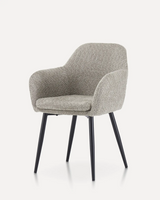 Modern soft velvet upholstered dining chair with ergonomic seating and black metal legs for hotels, Airbnb properties, furnished apartments, restaurants, cafés, and contemporary dining spaces.