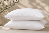 Standard white bed pillow with soft supportive filling, designed for hotels, Airbnb properties, furnished apartments, and vacation rentals for a comfortable night's sleep.