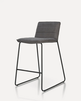 Modern Uphol upholstered bar stool with a fabric cushioned seat and black metal legs, designed for kitchen islands, hotels, Airbnb properties, furnished apartments, cafés, and contemporary dining spaces.
