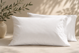 White waterproof pillow protector designed to protect pillows from moisture, dust, and daily wear, ideal for hotels, Airbnb properties, vacation rentals, and furnished apartments.