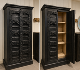 Hand-Carved Black Mango Wood Cabinet handcrafted from premium solid mango wood, featuring ornate carved panel doors, a distressed black finish, spacious interior shelving, and timeless Antique Indian craftsmanship.