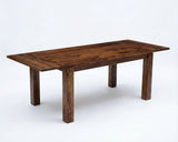 Solid Sheesham wood extendable dining table with natural wood grain, rectangular top, and extension leaves.
