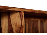 Close-up detail of solid Sheesham wood furniture showing the natural grain, warm brown tones, and handcrafted construction.