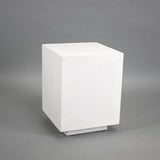 White concrete stool that doubles as an indoor and outdoor side table for hotels, Airbnb properties, furnished apartments, patios, and contemporary interiors.