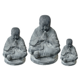Shaolin cast stone Buddha statue with a lava stone finish available in three sizes for hotels, Airbnb properties, furnished apartments, gardens, wellness spaces, and contemporary Zen interiors.