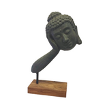 Sleeping Buddha face polyresin sculpture on a wooden stand available in two sizes for hotels, Airbnb properties, furnished apartments, wellness spaces, and contemporary Zen interiors.