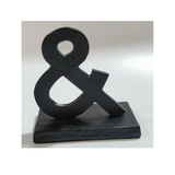Modern aluminum ampersand table decoration with a metallic finish for shelves, desks, hotels, Airbnb properties, furnished apartments, and contemporary interiors.