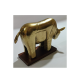 Modern aluminum bull sculpture on a wooden base for hotels, Airbnb properties, furnished apartments, offices, shelves, and contemporary interiors.