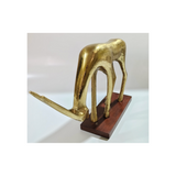 Modern aluminum goat sculpture on a wooden base for hotels, Airbnb properties, furnished apartments, offices, shelves, and contemporary interiors.