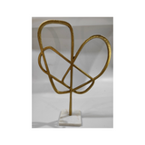 Modern aluminum heart table ornament with a metallic finish for hotels, Airbnb properties, furnished apartments, offices, shelves, and contemporary interiors.