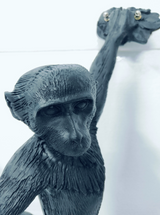 Modern aluminum monkey sculptural floor lamp for hotels, Airbnb properties, furnished apartments, offices, and contemporary luxury interiors.
