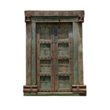 Antique carved wood door with distressed finish and traditional handcrafted details
