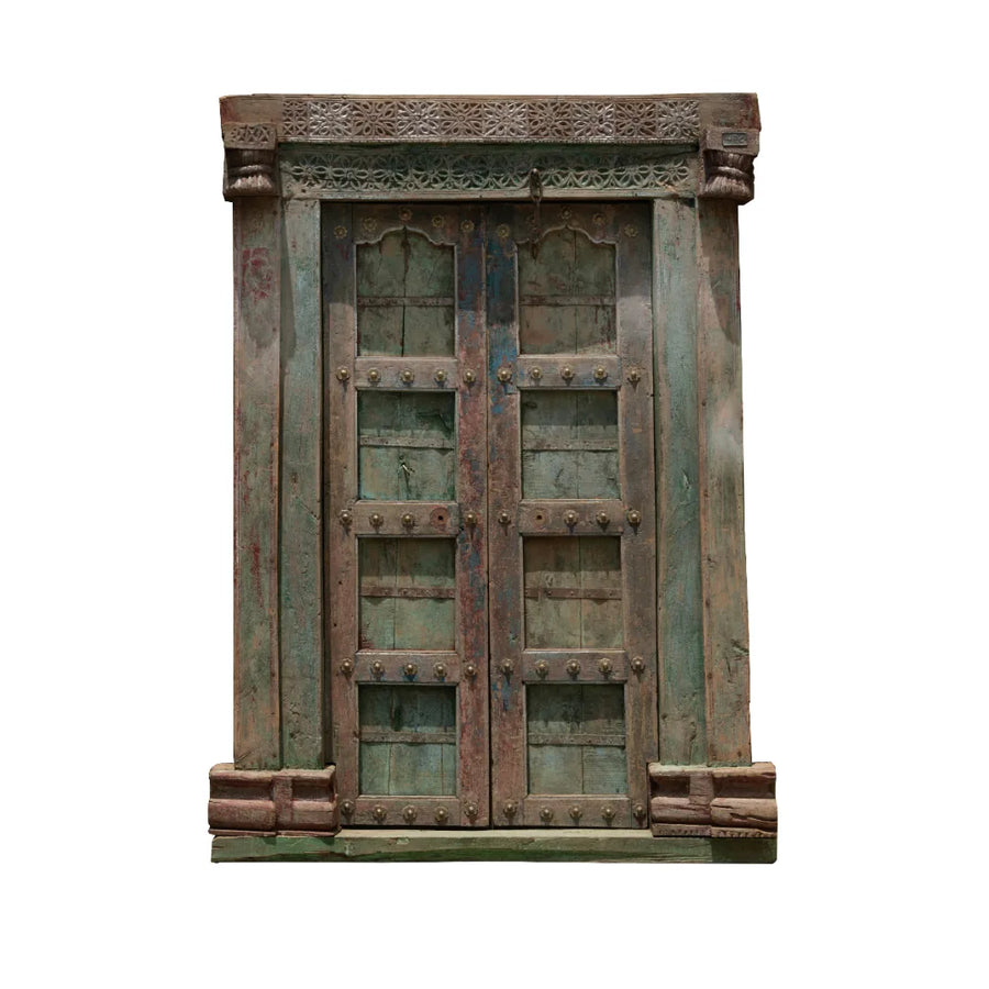 Antique carved wood door with distressed finish and traditional handcrafted details
