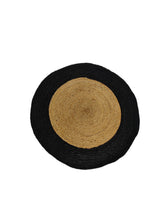 Handcrafted black braided jute area rug made from natural fibers for hotels, Airbnb properties, furnished apartments, bedrooms, living rooms, and contemporary interiors.