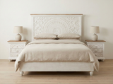 Casa hand-carved mango wood bed displayed in an elegant bedroom