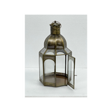 Copper iron and glass decorative lantern with a portable handle for hotels, Airbnb properties, furnished apartments, patios, gardens, and contemporary interiors.