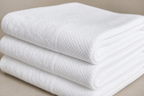 White hand towel with the Corporate Stays logo measuring 35 × 75 cm for hotels, Airbnb properties, furnished apartments, spas, and luxury guest bathrooms.