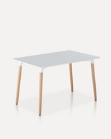 Modern white dining table with a smooth MDF tabletop and solid beech wood legs for hotels, Airbnb properties, furnished apartments, vacation rentals, and contemporary dining spaces.