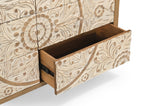 Hand-carved floral drawer fronts on the Goa dresser