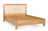 Angled view of the Goa carved mango wood bed