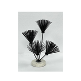 Decorative iron flower sculpture on a natural marble base for hotels, Airbnb properties, furnished apartments, offices, shelves, and contemporary interiors.