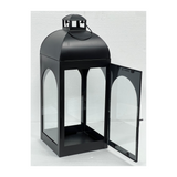 Modern iron and glass geometric lantern for candles, patios, hotels, Airbnb properties, furnished apartments, and contemporary indoor or outdoor décor.