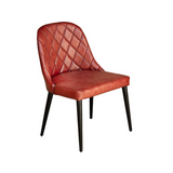 Modern dining chair with genuine leather upholstery and durable iron legs for hotels, Airbnb properties, furnished apartments, restaurants, cafés, and contemporary dining spaces.