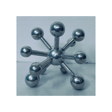 Modern steel geometric table sculpture with a metallic finish for hotels, Airbnb properties, furnished apartments, offices, shelves, and contemporary interiors.