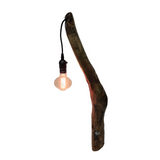 Handcrafted recycled wood table lamp with a warm ambient light bulb for hotels, Airbnb properties, furnished apartments, bedrooms, and contemporary interiors.