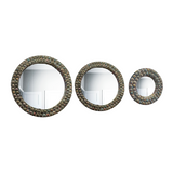 Round wall mirror with a handcrafted recycled magazine paper frame available in three sizes for hotels, Airbnb properties, furnished apartments, and contemporary interiors.