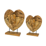 Handcrafted teak root heart sculpture on a stand with a Light Wood Wax finish, available in two sizes for hotels, Airbnb properties, furnished apartments, and contemporary interiors.