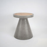 Concrete side table with a solid oak wood top for indoor and outdoor use in hotels, Airbnb properties, furnished apartments, patios, and contemporary interiors.